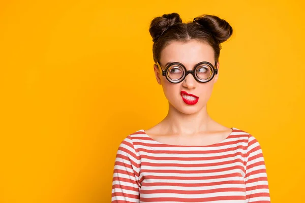 Closeup photo of evil mad crazy lady student grimacing grinning showing teeth look side wear circle freak specs striped red white shirt isolated bright yellow color background