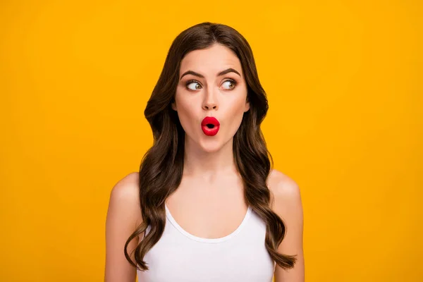 Closeup photo of beautiful pretty lady open mouth positive good mood red lipstick look side empty space wear white tank-top isolated bright yellow color background — Stock Fotó