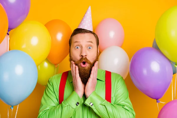 Close up photo of astonished crazy gentleman enjoy birthday party get present gift impressed scream wow wear dotted cone cap good look clothing over shine color background — Φωτογραφία Αρχείου