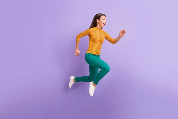 Full length body size view of nice attractive lovely cheerful cheery glad excited dreamy energetic girl running fast enjoying speed movement isolated on violet purple lilac pastel color background — 图库照片