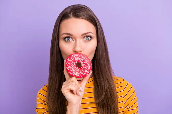 Portrait of surprised shocked crazy funky girl close hide her lips with colorful tasty sweet doughnut wear style stylish trendy jumper isolated over purple color background — 스톡 사진