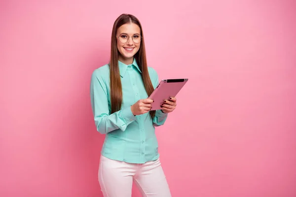 Portrait of positive clever intelligent girl marketer assistant use tablet read document wear formalwear turquoise outfit isolated over pastel color background — 图库照片