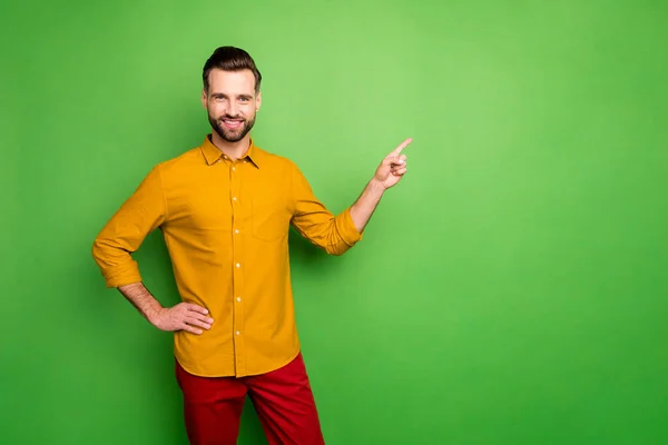 Portrait of his he nice attractive cheerful cheery content guy in formal shirt showing copy space like ad advert isolated on bright vivid shine vibrant green color background — ストック写真