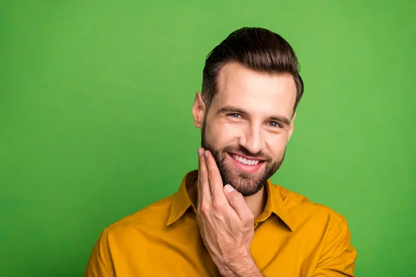 Close-up portrait of his he nice attractive cheerful cheery glad bearded guy touching fresh stubble isolated over bright vivid shine vibrant green color background — Φωτογραφία Αρχείου