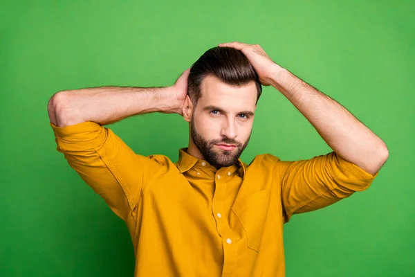 Close-up portrait of his he nice attractive content virile bearded guy touching hair modern coiffure isolated over bright vivid shine vibrant green color background — Stock Photo, Image