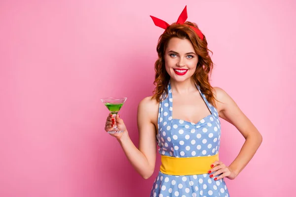 Photo of amazing stunning lady holding green alcohol cocktail glass theme retro party birthday wear red headband dotted dress yellow belt isolated pink color background — ストック写真