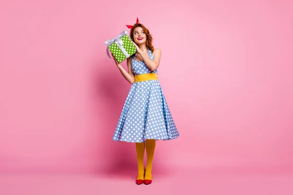 Full size photo of positive cute interested sweet lady get wish desire gift box 8-march holiday wear blue polka-dot pantyhose red footwear isolated over pink color background — 스톡 사진