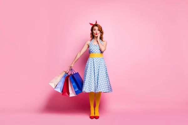 Full body photo funky cute pretty dreamy girl go shopping client center hear bargain stare stupor hold bags wear blue red footwear headband yellow pantyhose isolated pink color background — Zdjęcie stockowe