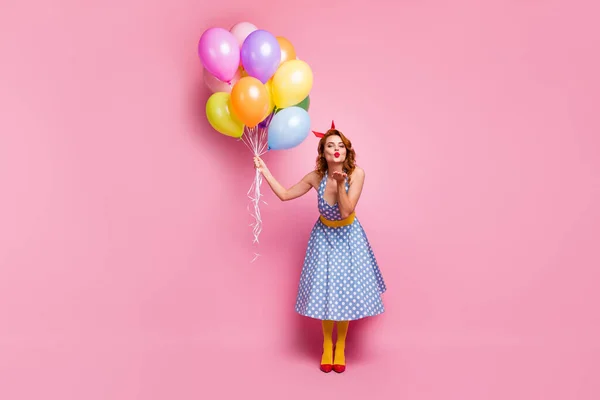 Full length photo romantic dream pretty cute girl enjoy 14-february send air kiss hold decoration helium baloons wear red footwear pantyhose blue polka-dot look isolated pink color background — Stockfoto