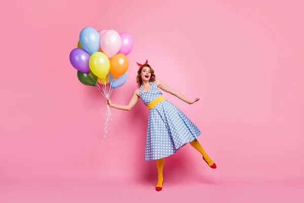 Full size photo of crazy pretty childish trend girl enjoy positive cheerful walk weekend hold air balls baloons wear stockings red shoes isolated over pink color background — 스톡 사진