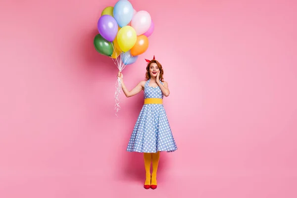 Full body photo of crazy excited lady have summer anniversary event hold many baloons impressed gift scream wow omg wear yellow blue pantyhose isolated over pink color background — ストック写真
