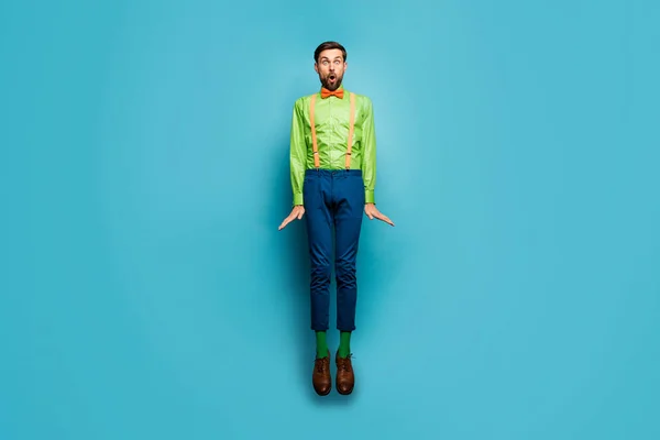 Full length body size view of his he nice attractive funky childish comic cheery amazed guy jumping having fun fooling isolated on bright vivid shine vibrant blue green teal turquoise color background — Stockfoto