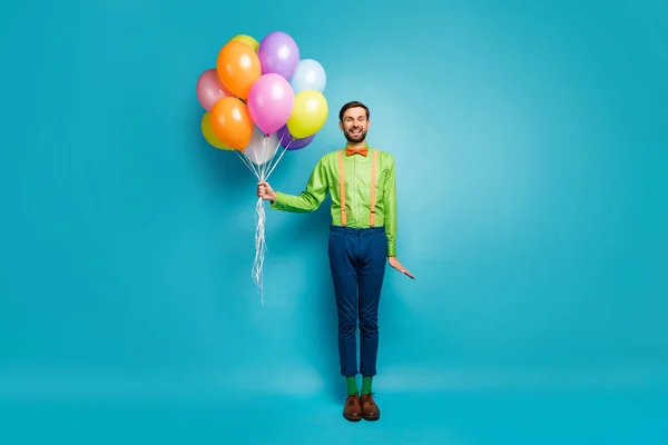 Full length body size view of nice attractive cheerful guy holding in hands air balls wedding surprise party evening isolated on bright vivid shine vibrant blue green teal turquoise color background — Stockfoto