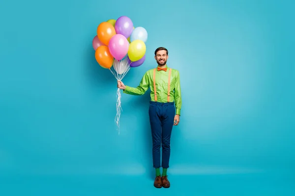 Full length body size view of nice attractive funky cheerful cheery guy holding in hands air balls festal day wedding isolated on bright vivid shine vibrant blue green teal turquoise color background — Stockfoto