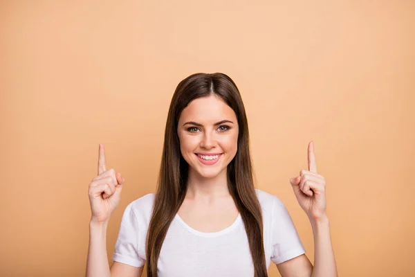 Close up photo of positive cheerful girl promoter present ads display promotion wear modern clothing isolated over beige color background — Stockfoto