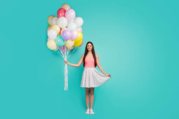 Full body photo of charming elegant pretty girl hold many air baloons she get present on spring time anniversary wear good look singlet shoes isolated pastel turquoise color background — Stockfoto