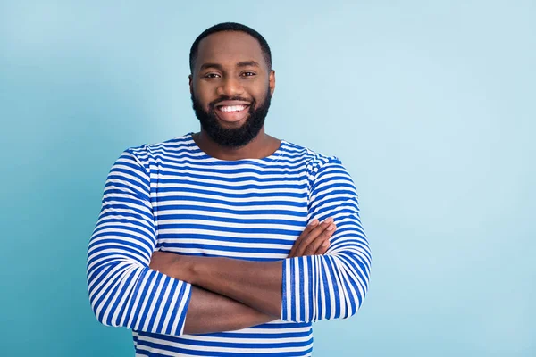 Portrait of positive cheerful professional afro american man cross hands look in camera listen to his friends colleagues wear nautical vest isolated over blue color background — Stock Photo, Image