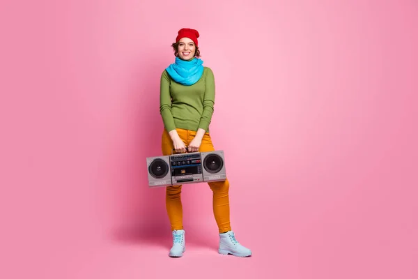 Full size photo of cheerful dreamy girl hold retro rhythm boom box enjoy weekend party wear blue red headwear footwear isolated over pink color background — Stock fotografie