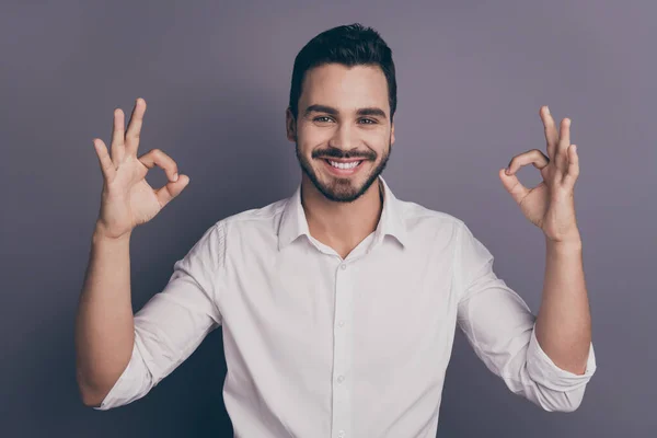 Photo of handsome business guy showing okey symbols hands approving good quality amazing new novelty product wear white office shirt isolated grey color background — 图库照片