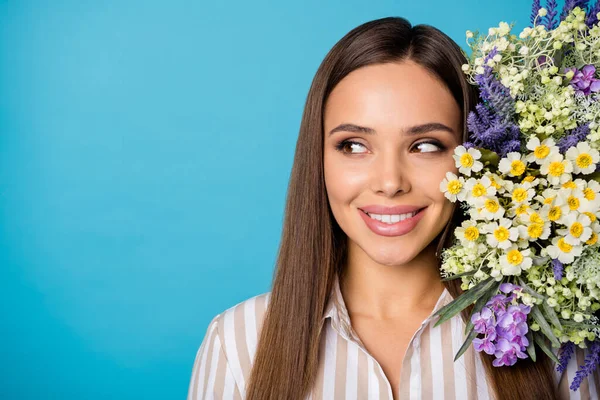 Closeup photo of charming lady enjoy wildflowers bunch present banner idea concept look side empty space see advert offer wear striped shirt isolated blue color background — Φωτογραφία Αρχείου