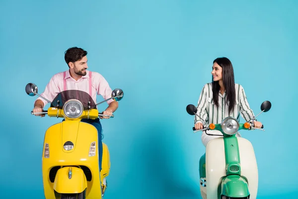 Positive cheerful lovely wife husband bikers drive choppers look enjoy motor bike way traveling wear striped pink formalwear shirt isolated over blue color background — Stock Fotó