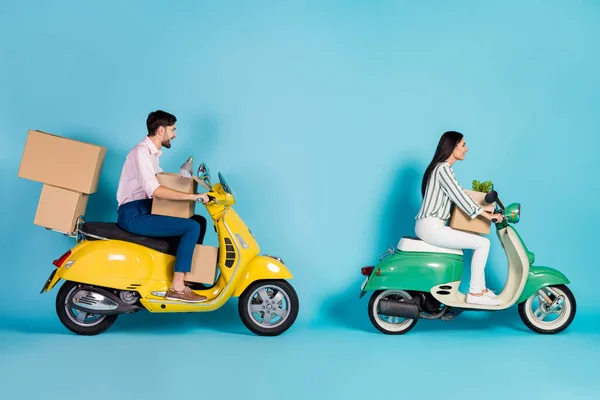 Full size profile side photo positive married couple rider driver get mortgage property move modern apartment drive motor bike carry packages lamp flower isolated blue color background — Fotografia de Stock