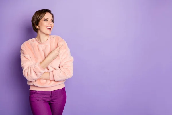 Portrait of cheerful positive girl promoter enjoy promo ads she look indicate present laugh wear casual style fuzzy outfit isolated over purple color background — 图库照片