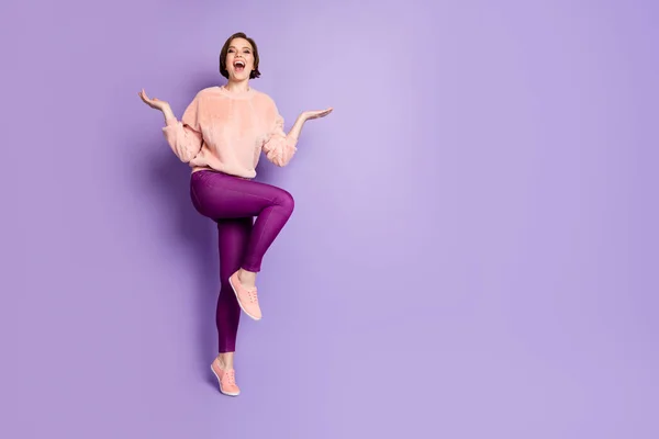 Full length photo of cheerful girl have fun on fall winter holidays fooling laughing feel rejoice wear casual style outfit isolated over purple color background — Zdjęcie stockowe