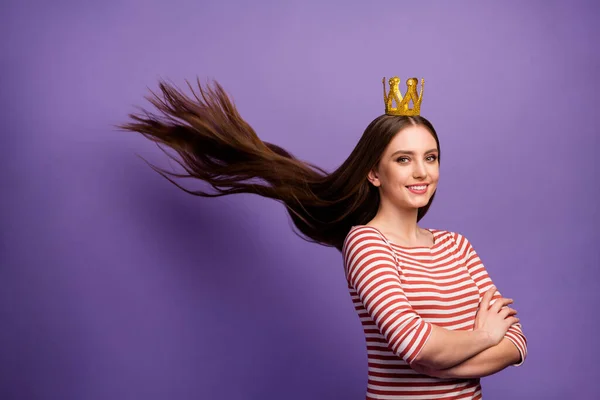 Portrait of positive cheerful smart high school girl crossing her hands proud of her prom party win gold crown haircut fly throw wear white sweater isolated over purple color background — ストック写真