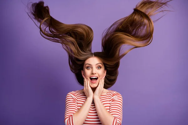 Portrait of energetic crazy astonished girl touch her hand face scream impressed by strong smooth shiny hairstyle fly air wind wear pullover isolated over violet color background — Stock fotografie