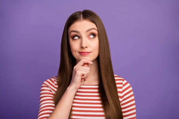 Closeup photo of attractive lady good mood long perfect hairstyle look interested side empty space arm on chin wear casual striped shirt isolated pastel purple color background — 스톡 사진