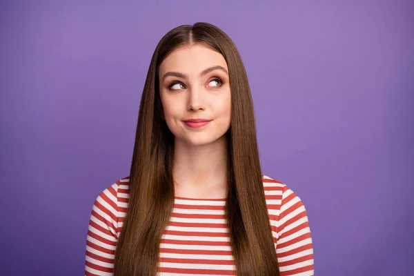 Closeup photo of attractive funny lady good mood long perfect hairstyle look interested side empty space wear casual striped shirt isolated pastel purple color background — 스톡 사진