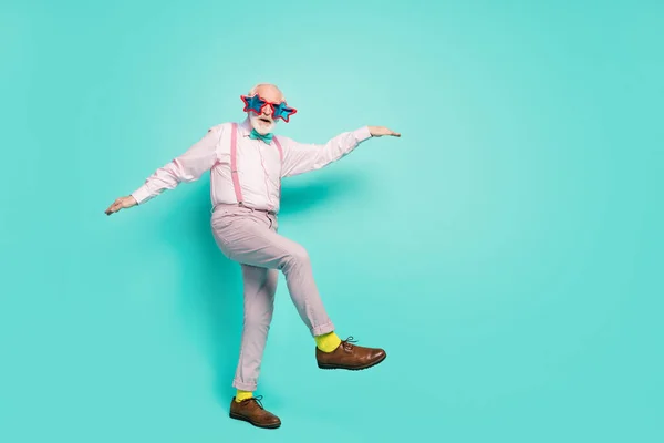 Full size photo of excited energetic old man enjoy dancing clubbing on vintage event concert wear good look shirt grey trousers brown footwear isolated over turquoise color background — 图库照片