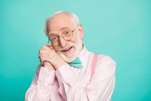 Closeup photo of amazing stylish clothes grandpa affection facial expression arms near ear head overjoyed wear specs pink shirt suspenders bow tie isolated bright teal color background — Stok fotoğraf