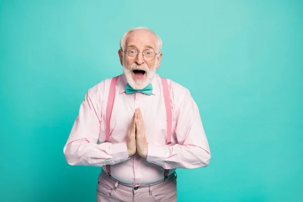 Profile photo of funny excited hipster grandpa raise arms begging to go senior party tonight wear specs pink shirt suspenders bow tie pants isolated teal color background — Stock Photo, Image