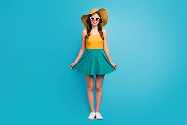 Full size photo charming lovely pretty girl enjoy spring free time weekend touch her dress skirt wear shine short mini tank-top gumshoes isolated blue color background — Stockfoto