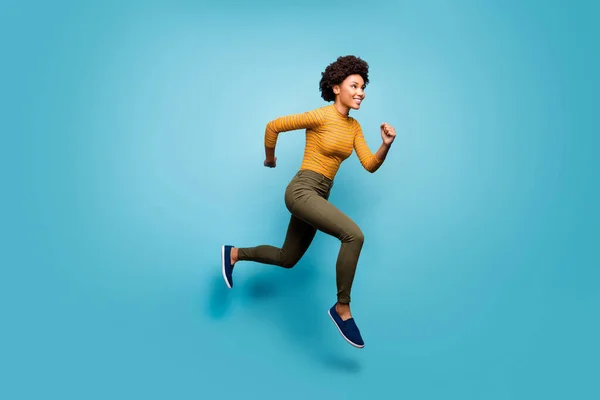 Full length body size view of nice lovely healthy cheerful active purposeful wavy-haired girl running season marathon isolated on bright vivid shine vibrant blue green teal turquoise color background — Stockfoto