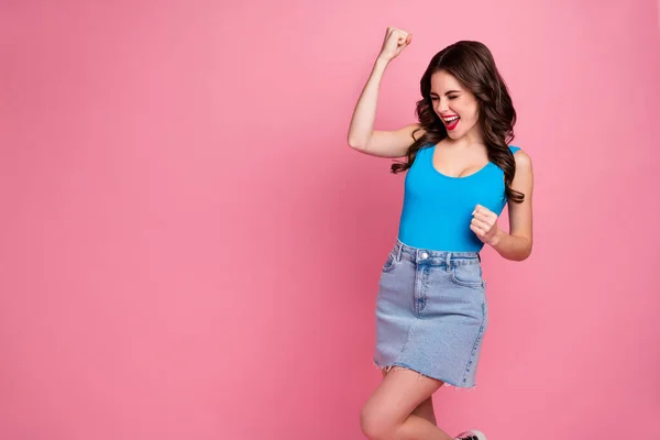 Photo of funky pretty crazy lady raise fists celebrating weekend sale shopping achievement wear casual blue tank-top denim jeans mini skirt isolated pink bright color background — Stock Photo, Image