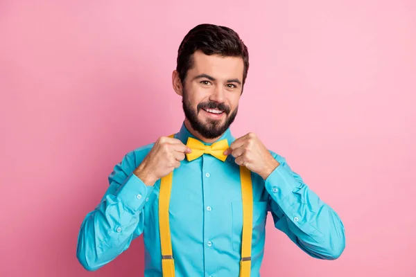 Close-up portrait of his he nice attractive cheerful cheery content imposing well-dressed bearded guy wearing festal mint blue shirt fixing bow-tie isolated over pastel pink color background — Stock Photo, Image