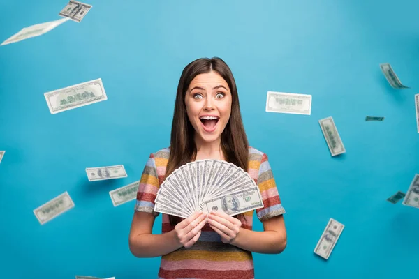 Close-up portrait of her she nice lovely pretty amazed crazy overjoyed cheerful cheery girl holding in hand fan cashback sale discount isolated over bright vivid shine vibrant blue color background — 스톡 사진