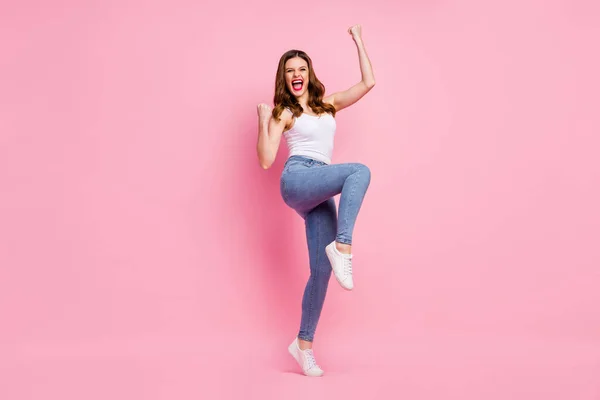 Full length photo of delighted cheerful girl enjoy her sport competition victory raise fists scream yeah wear good look modern clothing isolated over pastel color background — Stock Photo, Image