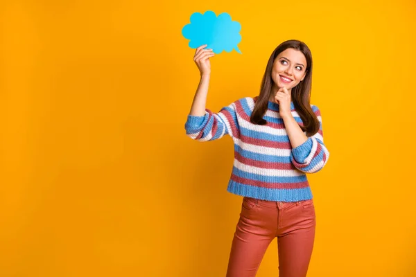 Portrait of interested minded girl hold blue paper card speech bubble think thoughts about future spring holiday free time wear jumper pants isolated over bright shine color background — Stock Photo, Image