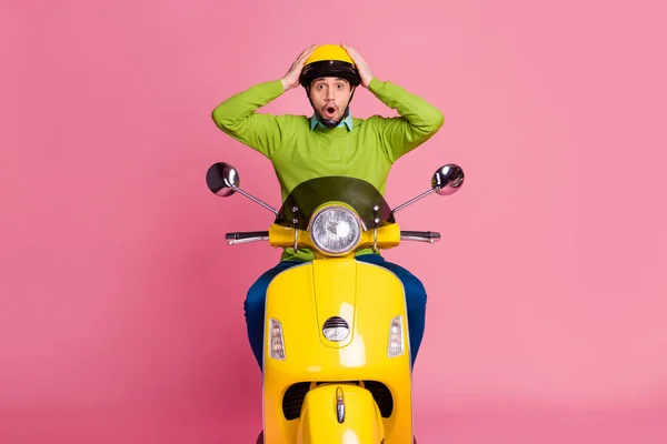 Portrait of his he nice atraksed overmed guy riding motorbike wow news reaction discount isolated over pink pastel color background — Stok Foto