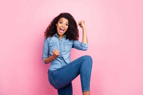 Portrait of delighted funky youth afro american girl win lottery scream yeah raise fists wear stylish outfit isolated over pink color background — Stock Photo, Image