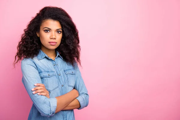 Turned photo of serious manager afro american girl cross hands copyspace clever intelligent expert wear stylish outfit isolated over pink color background