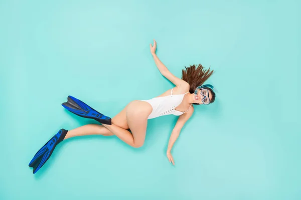 Full length high angle above flat lay photo of funky lady swimming fast ocean water see coral reef view using flippers tube mask wear bodysuit isolated pastel teal color background — Stock Photo, Image