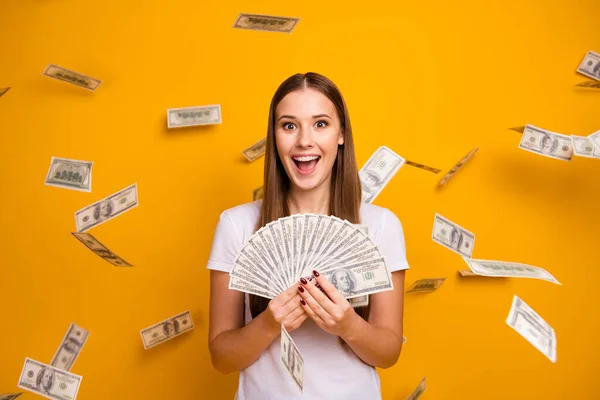 Astonished crazy girl student hipster hold money fan enjoy jackpot she get credit bank lottery usd banknotes fly fall impressed scream wear white t-shirt isolated bright shine color background — Stock Photo, Image