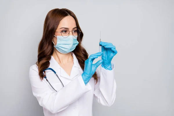 Close-up portrait of her she nice attractive wavy-haired doc surgeon nurse phonendoscope stethoscope making shot clinic hospital procedure isolated over grey pastel color background