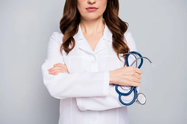 Cropped close-up portrait of her she nice attractive content wavy-haired doc folded arms patient diagnostic center clinic disease sickness illness isolated over grey pastel color background — Stock Photo, Image