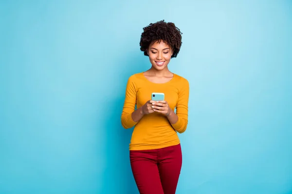 stock image Portrait of her she nice attractive lovely focused cheerful cheery wavy-haired girl using device share repost media isolated over bright vivid shine vibrant blue color background